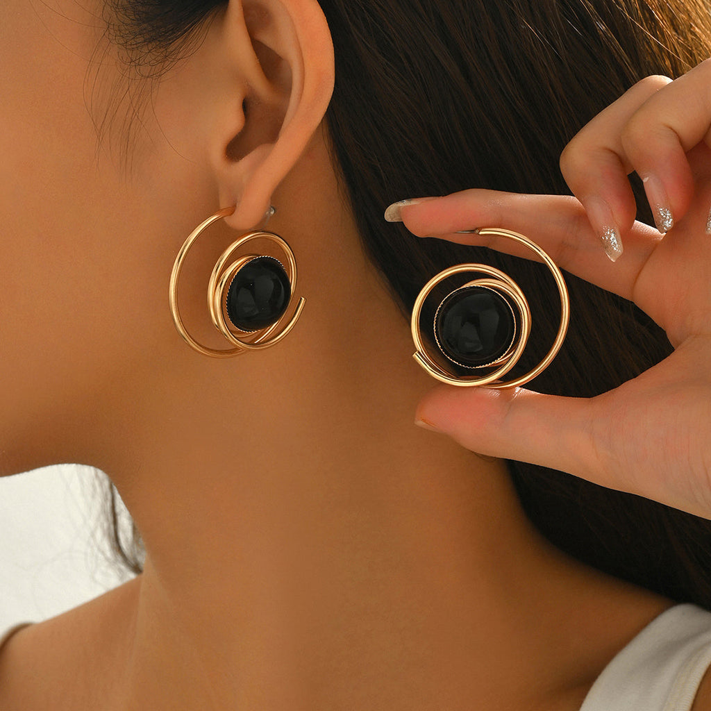 Boucles d'Oreilles Spirale Dorée et Pierre Noire