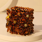 Statement-Armband Hölzer & Blumen — Handgefertigtes Maxi-Armband mit floralem Detail