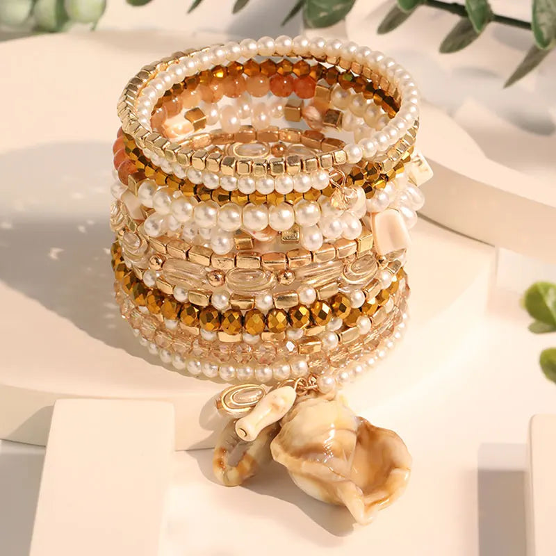 Ensemble de bracelets bohèmes dorés et perles avec coquillage