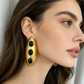 Boucles d’Oreilles Maxi Dorées aux Pierres Noires