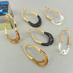 Boucles d’Oreilles Dorées avec Détail Translucide en Acrylique