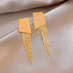 Boucles d’Oreilles Maxi Dorées Géométriques à Franges
