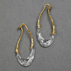 Boucles d’Oreilles Dorées avec Détail Translucide en Acrylique